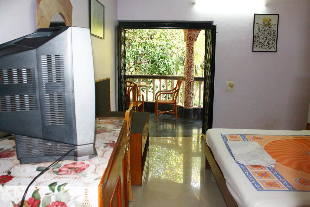 White Pearl Guest House Морджим Номер фото